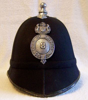 Port of Bristol Helmet; 1950's
Port of Bristol Helmet; 1950's, cork body with six panel covering, narrow cloth band with chromed balltop and helmet plate with officers number
Keywords: port bristol helmet headwear